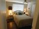 Cozy bedroom with a comfy bed, lovely bedside tables, and stylish decor create a relaxing atmosphere at 114 Azalea Trl, Leesburg, FL 34748