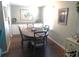 Bright dining room featuring a round table, ample seating, and a built-in sideboard at 114 Azalea Trl, Leesburg, FL 34748
