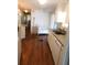 Efficient kitchen with clean white cabinetry, modern appliances, and easy access to dining area at 114 Azalea Trl, Leesburg, FL 34748