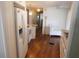 Bright kitchen features wood floors, stainless appliances, and a breakfast bar at 114 Azalea Trl, Leesburg, FL 34748