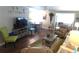 Cozy living room featuring comfortable seating, warm lighting, and an inviting atmosphere at 114 Azalea Trl, Leesburg, FL 34748