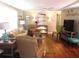 Relaxing living area featuring a comfortable sofa, soft lighting, and well-appointed décor at 114 Azalea Trl, Leesburg, FL 34748