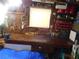 Organized workshop area with pegboards, shelves, and a large workbench for various projects at 114 Azalea Trl, Leesburg, FL 34748