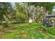Spacious backyard with plenty of room for outdoor activities and a screened in porch at 1214 Loch Rannoch Ct, Leesburg, FL 34788