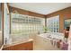 Bright bathroom featuring glass block window, garden tub, and separate shower at 1214 Loch Rannoch Ct, Leesburg, FL 34788