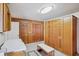 Bright laundry room featuring wood accents and plenty of storage space at 1214 Loch Rannoch Ct, Leesburg, FL 34788