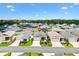 Residential aerial view of home with front lawn and landscaping at 1225 Eunice St, The Villages, FL 34762