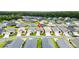 Neighborhood aerial view of homes with lush landscaping at 1225 Eunice St, The Villages, FL 34762