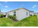 Home exterior featuring a manicured backyard and siding at 1225 Eunice St, The Villages, FL 34762