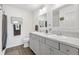 Clean, modern bathroom featuring double sinks, ample counter space, and updated fixtures at 1225 Eunice St, The Villages, FL 34762