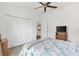 Cozy bedroom with white walls, closet and ceiling fan at 1225 Eunice St, The Villages, FL 34762
