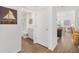 Hallway view to bathroom, dining area, and open floor plan at 1225 Eunice St, The Villages, FL 34762