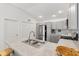 Bright kitchen boasting stainless steel appliances and ample countertop space at 1225 Eunice St, The Villages, FL 34762