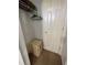 Small closet features a top shelf, hanging rack, carpeted floor and a safe at 130 Napoli Dr, Davenport, FL 33897
