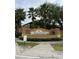 Regal Palms at Highland's Reserve entrance featuring lush landscaping and elegant signage with palm tree accents at 130 Napoli Dr, Davenport, FL 33897