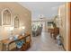 Open-concept foyer featuring neutral flooring, decorative table, and access to the living area at 1414 Cove Pl, Tavares, FL 32778