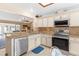 Kitchen with stainless appliances, breakfast bar, granite countertops, and view to living area at 1414 Cove Pl, Tavares, FL 32778
