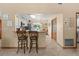 Kitchen with breakfast bar, tile flooring, wood cabinets, and stainless steel appliances at 1414 Cove Pl, Tavares, FL 32778