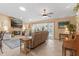 Cozy living room with a fireplace, french doors, tile flooring, and comfortable seating at 1414 Cove Pl, Tavares, FL 32778