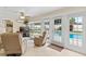 Inviting living room with comfortable seating and views of the pool area, perfect for relaxation at 1414 Cove Pl, Tavares, FL 32778