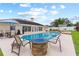 Outdoor living at its finest with this beautiful pool, patio, and built-in fire pit at 1414 Cove Pl, Tavares, FL 32778