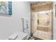 Modern shower with tile walls, a glass door, and a built-in bench for added comfort at 1414 Cove Pl, Tavares, FL 32778