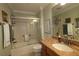 Updated bathroom with a glass-enclosed shower, granite countertop, and modern fixtures at 1553 Lynchburg Loop, The Villages, FL 32162