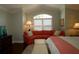 Bedroom featuring a plush couch, elegant decor, and plenty of natural light at 1553 Lynchburg Loop, The Villages, FL 32162