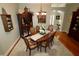 Cozy dining room with chandelier and hardwood floors, perfect for gatherings at 1553 Lynchburg Loop, The Villages, FL 32162
