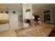 Eat-in kitchen featuring granite countertops, stainless steel appliances, and white cabinetry at 1553 Lynchburg Loop, The Villages, FL 32162