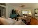 Comfortable living room with stylish furniture, hardwood floors, and lots of light at 1553 Lynchburg Loop, The Villages, FL 32162