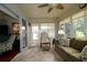 Inviting sunroom with large windows, a comfortable sofa, and seamless indoor-outdoor flow at 1553 Lynchburg Loop, The Villages, FL 32162