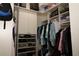 Organized walk-in closet with shelves and hanging rods maximizing storage space at 1553 Lynchburg Loop, The Villages, FL 32162