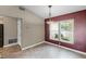 Cozy dining room with tile floor, natural light, and a stylish chandelier at 15916 Indian Wells Ct, Clermont, FL 34711