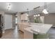 Eat-in kitchen featuring a breakfast bar, tile floors, and updated countertops at 15916 Indian Wells Ct, Clermont, FL 34711
