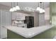 Well-equipped kitchen boasts white cabinetry, modern appliances, and ample counter space at 15916 Indian Wells Ct, Clermont, FL 34711