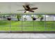 Screened-in patio showcasing the lush backyard with mature trees and tropical landscaping at 15916 Indian Wells Ct, Clermont, FL 34711