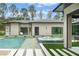 A chic backyard pool and outdoor space offers a sleek design with serene lounging at 16320 Pendio Dr, Bella Collina, FL 34756