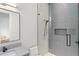 Contemporary bathroom featuring a walk-in shower with glass enclosure, modern vanity, and elegant fixtures at 16320 Pendio Dr, Bella Collina, FL 34756