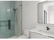 Sleek bathroom features a glass shower, modern vanity, and contemporary fixtures at 16320 Pendio Dr, Bella Collina, FL 34756