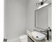 Modern powder room featuring a unique vessel sink, sleek black fixtures, and a contemporary vanity at 16320 Pendio Dr, Bella Collina, FL 34756