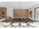 Stylish dining room featuring contemporary decor and a spacious layout with seating for eight at 16320 Pendio Dr, Bella Collina, FL 34756