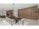 Open concept dining and kitchen area featuring wine storage wall and modern light fixture at 16320 Pendio Dr, Bella Collina, FL 34756