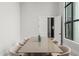 Bright dining room featuring modern table with seating and view of a modern window at 16320 Pendio Dr, Bella Collina, FL 34756