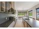 Modern kitchen with high-end appliances and outdoor views, blending style and functionality at 16320 Pendio Dr, Bella Collina, FL 34756