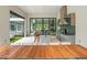 Bright kitchen featuring modern appliances, an island with seating, and an open-air design leading to the backyard at 16320 Pendio Dr, Bella Collina, FL 34756