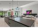Open concept kitchen and living room with high ceilings and plenty of natural light at 16320 Pendio Dr, Bella Collina, FL 34756