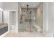 Main bathroom features a large shower and floating double sink vanity at 16320 Pendio Dr, Bella Collina, FL 34756