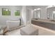 Spacious main bathroom with soaking tub, modern vanity, and refined finishes at 16320 Pendio Dr, Bella Collina, FL 34756