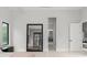 Bright main bedroom with large mirror and ensuite bathroom access in modern home at 16320 Pendio Dr, Bella Collina, FL 34756